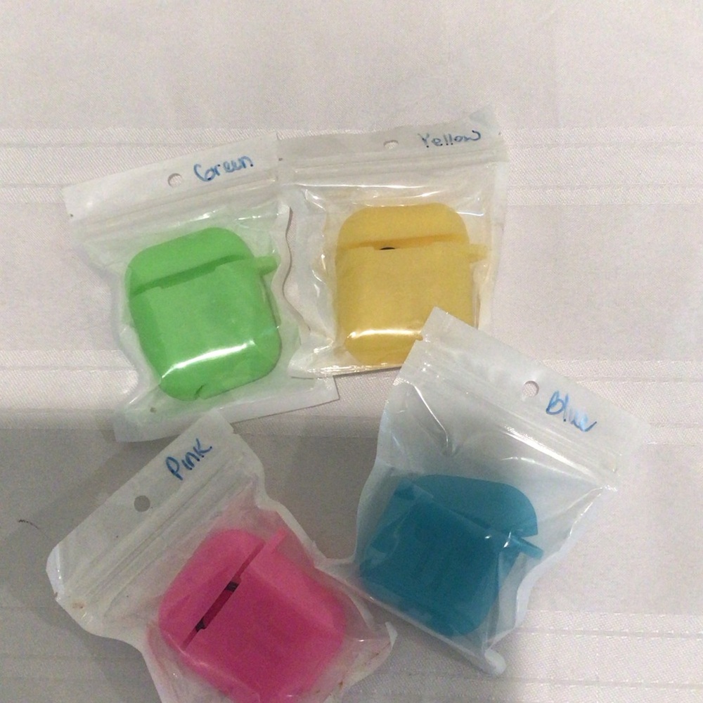 Apple AirPods Cases in Green, Yellow, Pink, and Blue